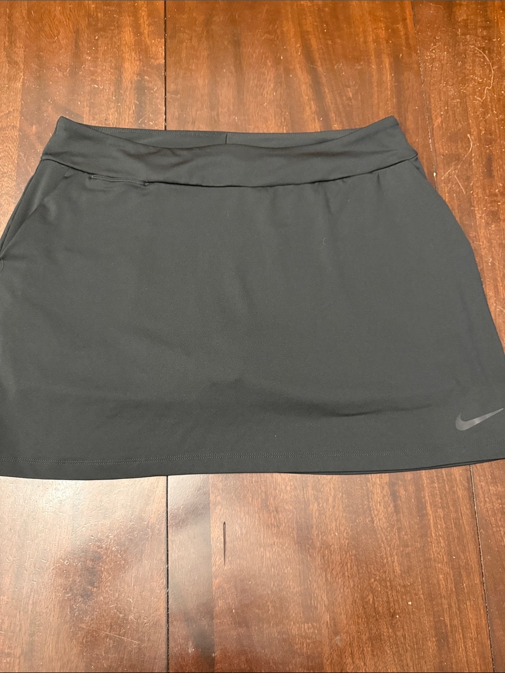 Nike Black Women’s Athletic Skort. Has pockets and key pocket.  Size L.